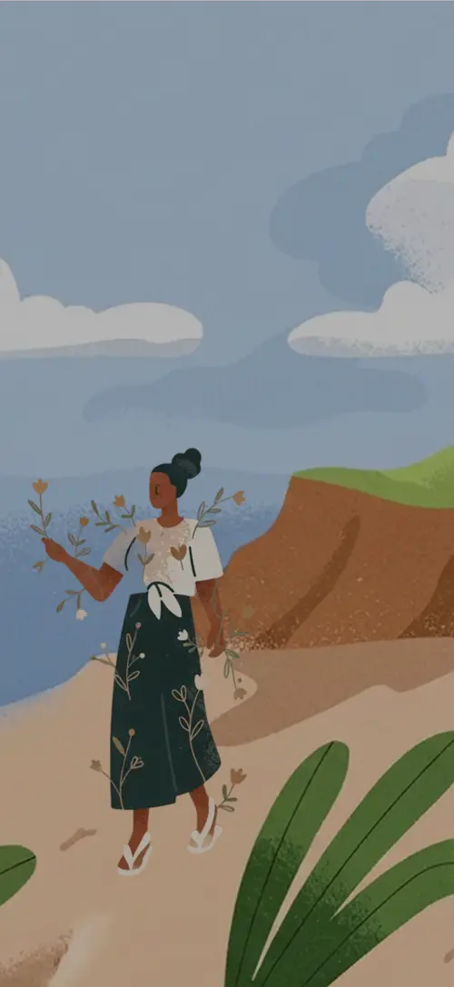 Person walking by the sea holding flowers